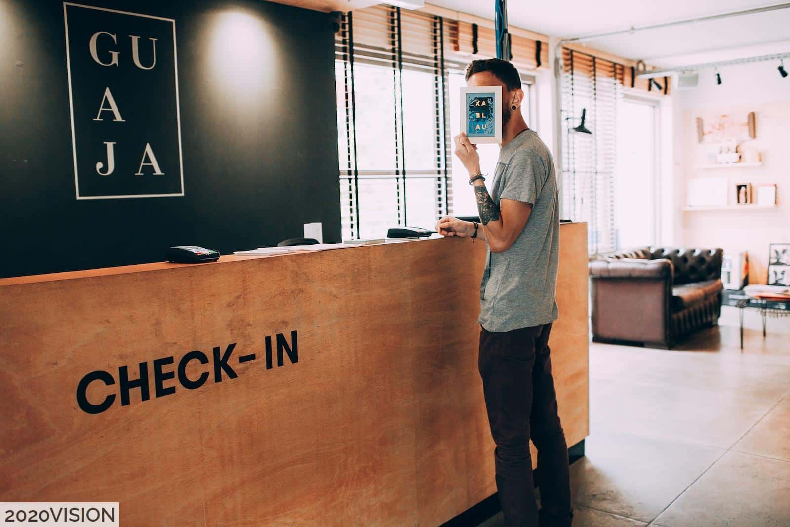 man standing beside counter