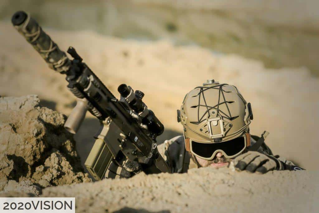 Soldier Wearing Brown Helmet Holding Assault Rifle during Daytime