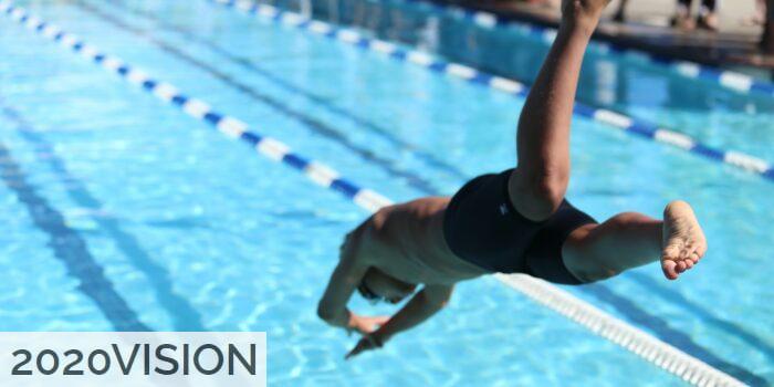 woman in black one piece swimsuit jumping on swimming pool during daytime