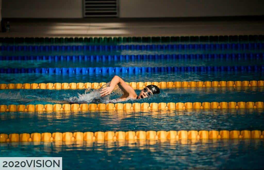 person diving in pool