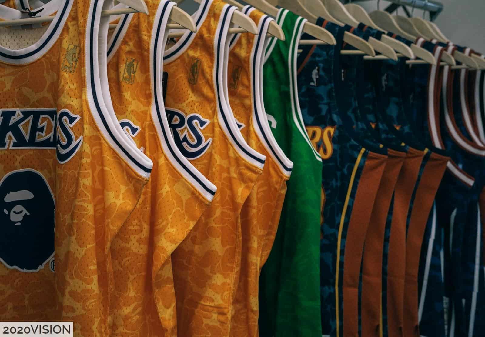 assorted NBA jerseys hanged on clothes hangers